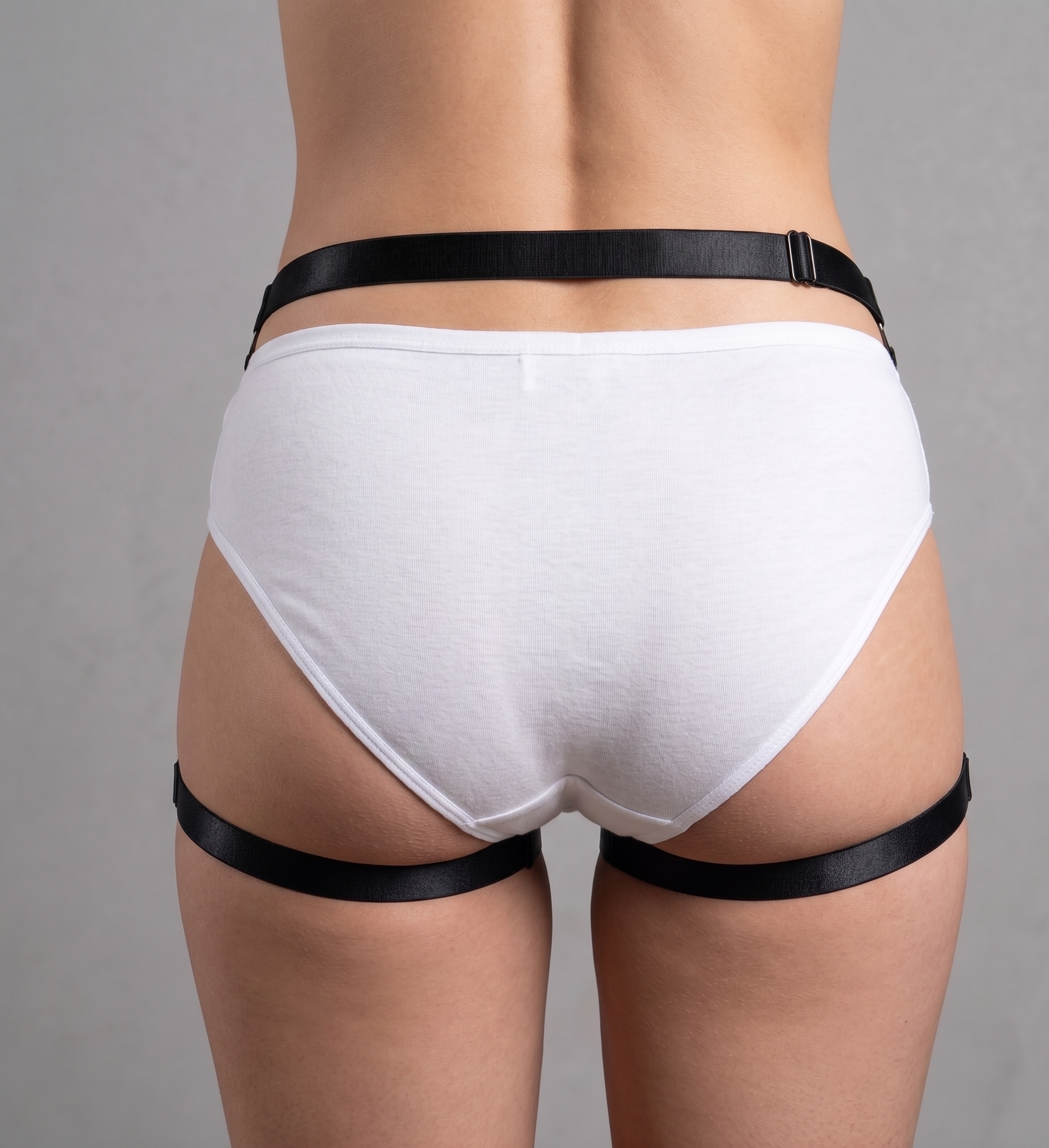 Back view of style P0163 strappy open-crotch panties, highlighting the minimalist black band structure.